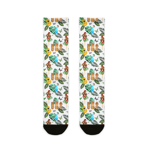 Tropical-themed socks with hula dancers, ukuleles, and leaves on a white background