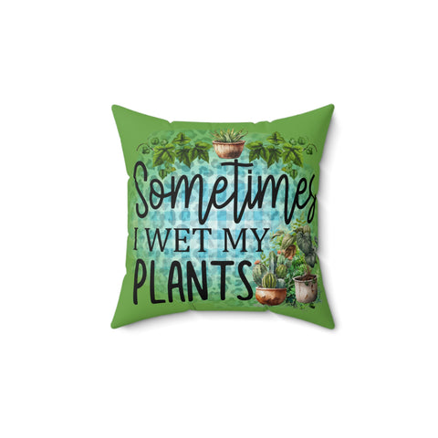 Green pillow with plant illustrations and text 'Sometimes I wet my plants' on a white background