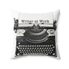 Pillow with a typewriter design and 'Writer at Work' text on a white background